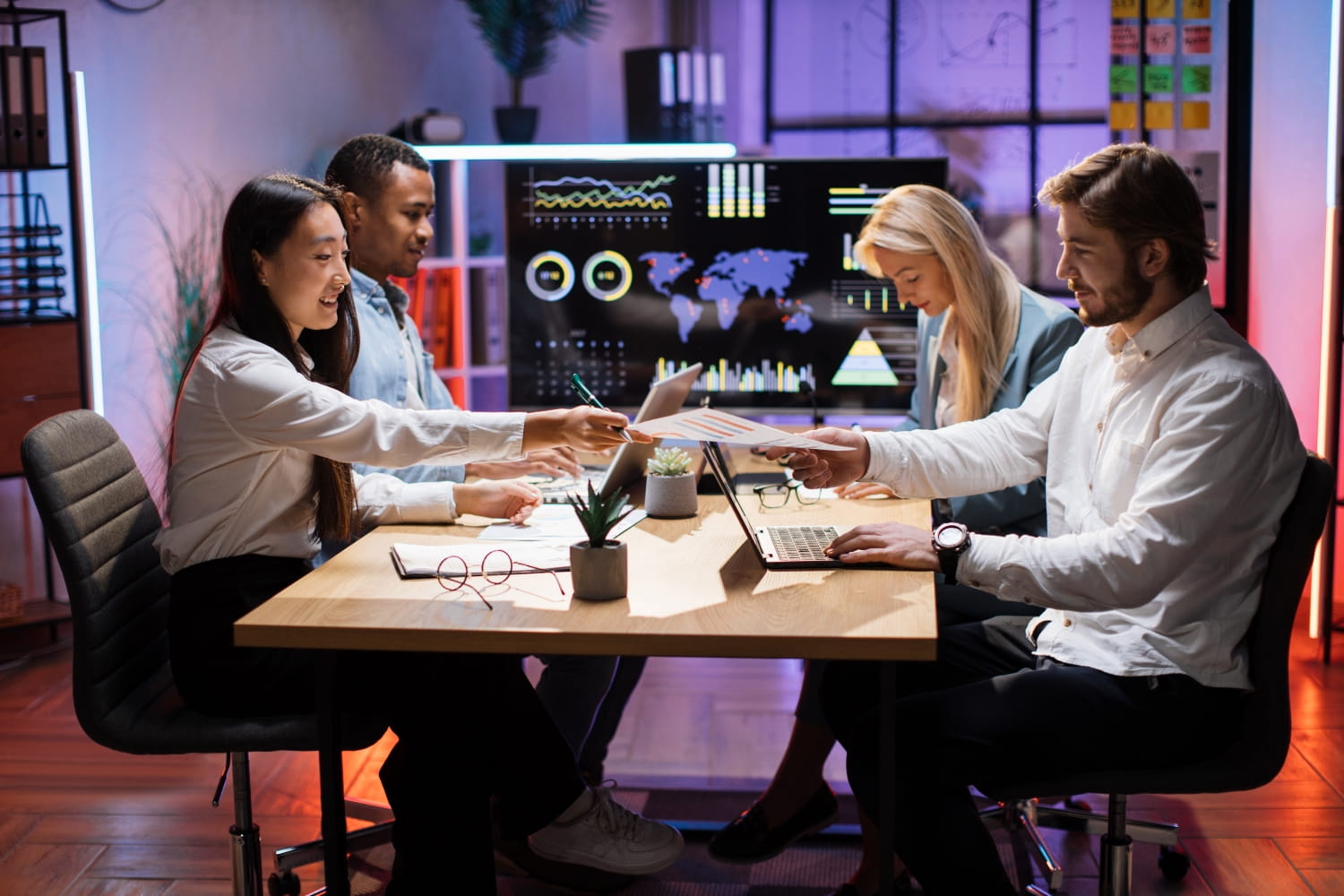 Team using business devices and software in the workplace